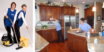 A woman is cleaning the kitchen floor and a person in the house